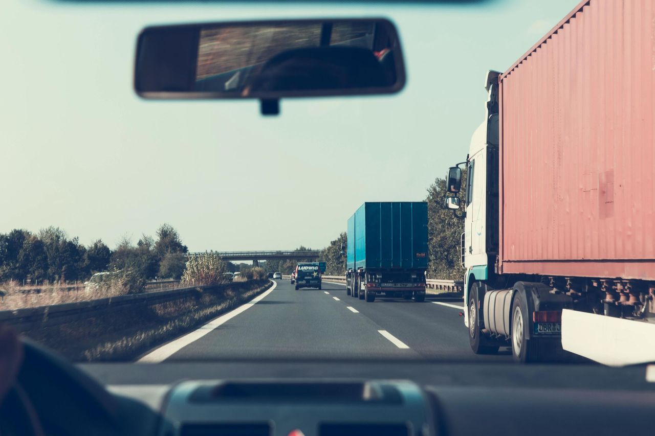View from inside a truck cab driving on the highway