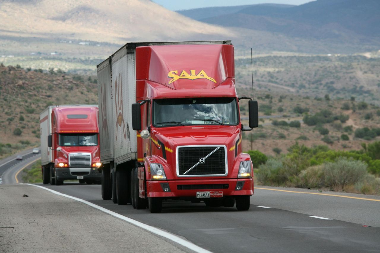 Red commercial truck on the highway
