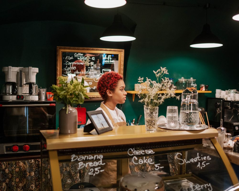 Small business owner working at a shop counter