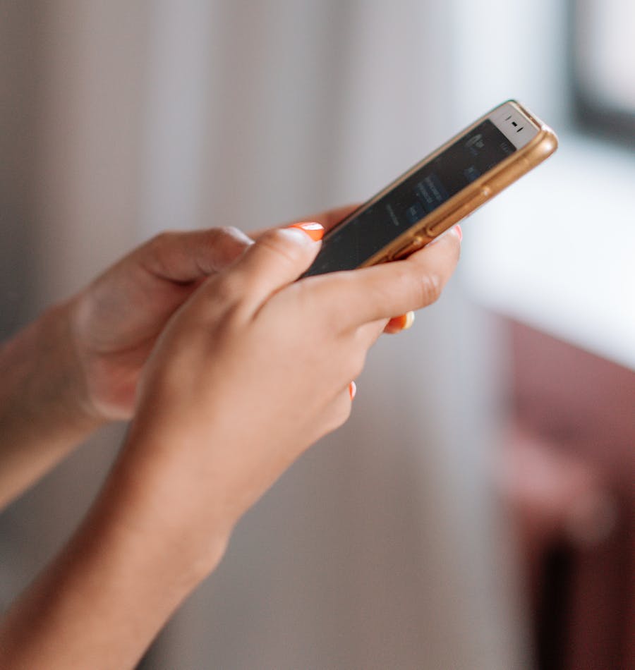 Person checking their phone for a quote update